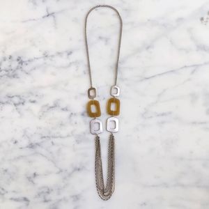 NWOT. The Limited Gold/Silver Tone Chains with Design Necklace.